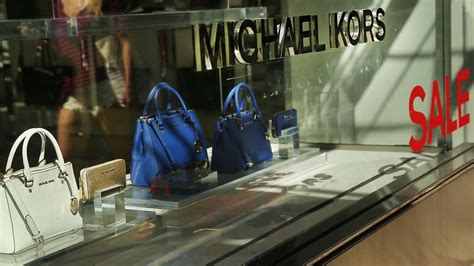 michael kors buys owner